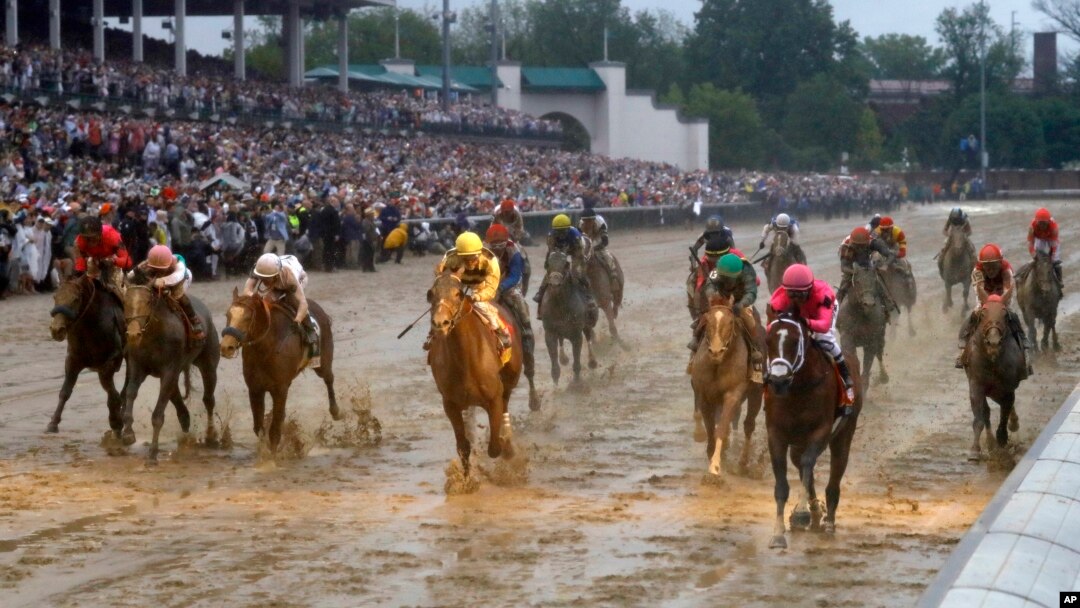 Luis Saez rides Maximum Security across the finish line first followed by Flavien Prat on Country House during the 145th running of the Kentucky Derby horse race at Churchill Downs, May 4, 2019, in Louisville, Ky.
