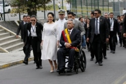 FILE - Ecuador's President Lenin Moreno, center right, and his wife Rocio Gonzalez arrive at the National Assembly in Quito, Ecuador, May 24, 2019.