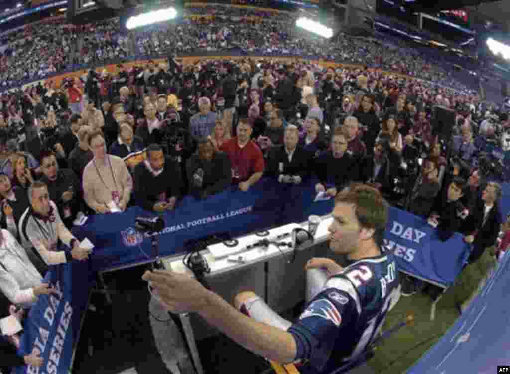 New England Patriots quarterback Tom Brady answers questions during Media Day for NFL football's Super Bowl XLVI Tuesday, Jan. 31, 2012, in Indianapolis. (AP Photo/David J. Phillip)