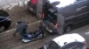 Workers load a body of Lt. Gen. Igor Kirillov, head of Russia's nuclear, biological, and chemical defense forces, into a bus after he and his assistant were killed by an explosive device in Moscow, Russia, Dec. 17, 2024. 