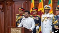 FILE - Commanders of the security forces stand behind as Sri Lanka's President Anura Kumar Dissanayake addresses a gathering after he was sworn in at the Sri Lankan President's Office in Colombo, Sri Lanka, Sept.23, 2024. (Sri Lankan President's Office via AP, File)