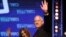 Blue and White party leader Benny Gantz and his wife Revital wave to supporters at party headquarters after the first results of the elections in Tel Aviv, Israel, Sept. 18, 2019. 