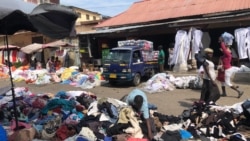 Piles of clothing and fabric can be found throughout Kantamanto market, many imported from Western countries, in Accra, Ghana, Sept. 22, 2020. (Stacey Knott/VOA)
