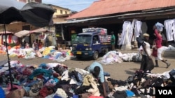 Piles of clothing and fabric can be found throughout Kantamanto market, many imported from Western countries, in Accra, Ghana, Sept. 22, 2020. (Stacey Knott/VOA)