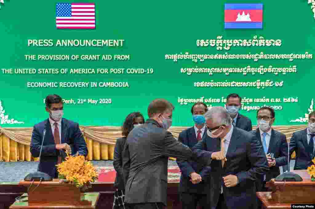 U.S. Ambassador W. Patrick Murphy elbow-greets Cambodian Minister of Economy and Finance, Aun Pornmoniroth, at an event announcing the U.S. assistance of $7.5 million, and a total of $11 million since the COVID-19 outbreak, supporting Cambodia’s response 