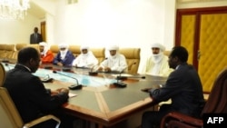 Burkina Faso President Blaise Compaore (R) meets with delegation of Ansar Dine for talks on Mali Nov. 6, 2012 in Ouagadougou