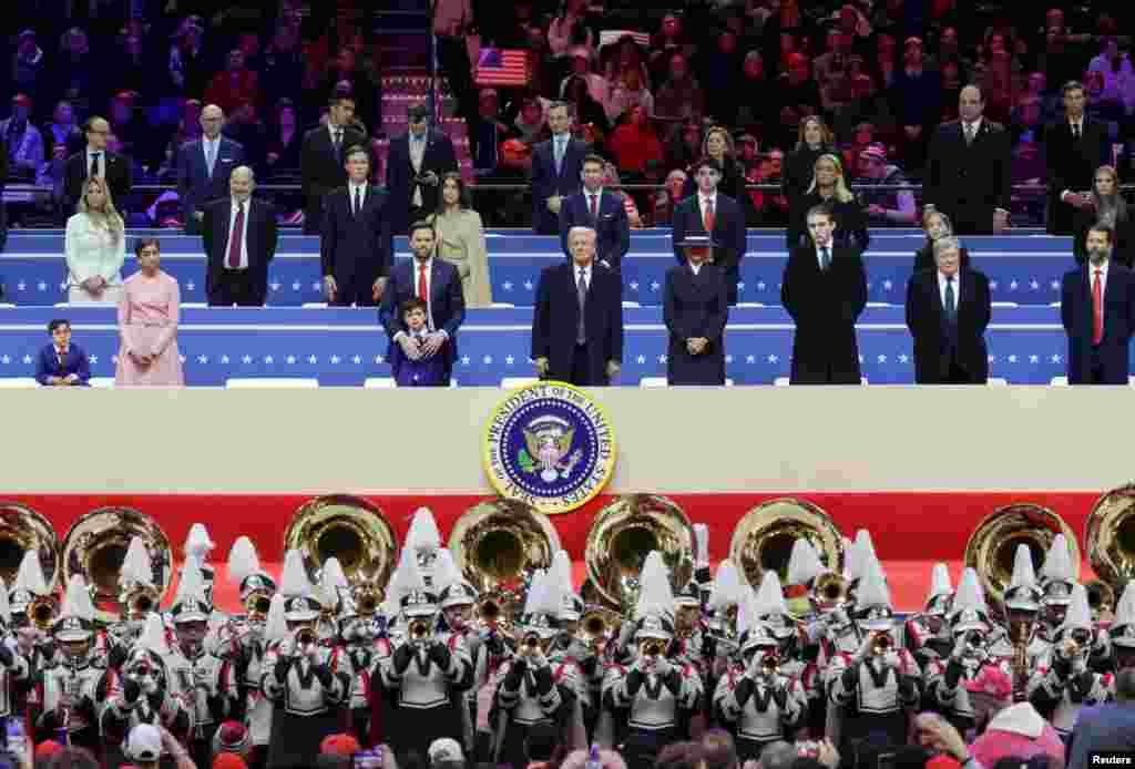 President Donald Trump, first lady Melania Trump. Vice President J.D. Vance, second lady Usha Vance, their children Ewan and Vivek, Barron Trump, Viktor Knavs, and Donald Trump Jr. attend a rally on the inauguration day inside Capital One, in Washington, Jan. 20, 2025.&nbsp;