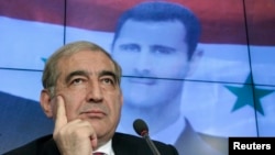 Phó Thủ tướng Syria Qadri Jamil tại cuộc họp báo ở Moscow, 21/8/13