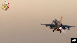 In this still image taken from video provided by the Egyptian military, an Egyptian fighter jet takes off from an undisclosed location in Egypt to strike militant hideouts in the Libyan city of Darna, May 26, 2017.