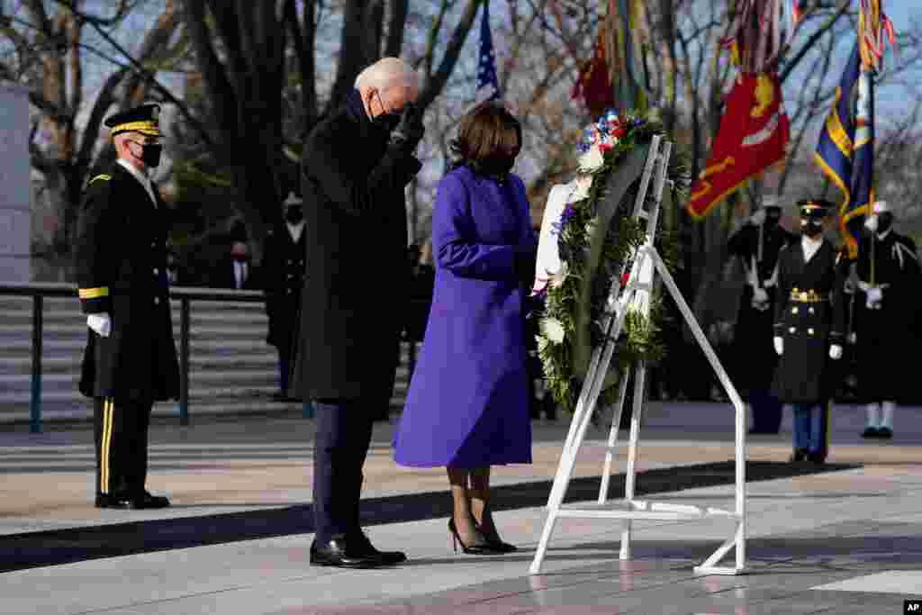 President Joe Biden and Vice President Kamala Harris participate in a wreath laying ceremony at the Tomb of the Unknown Soldier at Arlington National Cemetery in Arlington, Va.