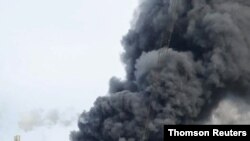 Smoke billows following an explosion in Leverkusen, Germany, July 27, 2021