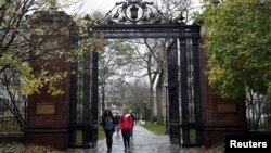 FILE - Students walk on the campus of Yale University in New Haven, Connecticut, Nov. 12, 2015. 
