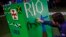A man arranges LEGO bricks to build a Rio sign during a LEGO presentation of a massive model of the city including the Olympic sites at the Media Center in Rio de Janeiro, Brazil, Aug. 1, 2016. 