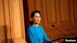 Myanmar's State Counsellor Aung San Suu Kyi gives a speech at the Swedish parliament in Stockholm