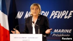 Marine Le Pen, French far-right National Front (FN) party president, member of European Parliament and candidate for French 2017 presidential election, speaks to the media in Paris, Jan. 4, 2017. 