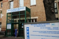 FILE - A medical staff member leaves the department of tropical infections and diseases at the Bichat hospital in Paris, Jan. 29, 2020.