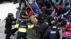 Pro-Trump protesters tear down a barricade as they clash with Capitol Police during a rally to contest the certification of the 2020 U.S. presidential election results by the U.S. Congress, at the U.S. Capitol Building in Washington, Jan. 6, 2021.