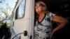 Janelle Crosby stands in a donated recreational vehicle where she has lived with her husband since Hurricane Michael in Springfield, Fla., May 1, 2019. Crosby fears the beginning of hurricane season.