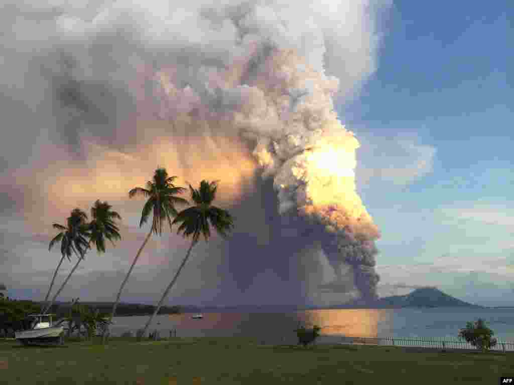 Mt. Tavurvur erupts in eastern Papua New Guinea, spewing rocks and ash into the air, forcing evacuation of local communities and international flights to be re-routed. Mt. Tavurvur destroyed the town of Rabaul when it erupted simultaneously with nearby Mt. Vulcan in 1994. (AFP/Oliver Bluett)