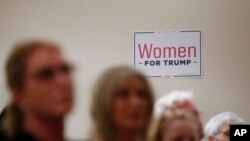Women listen during a training session for Women for Trump, An Evening to Empower, in Troy, Mich., Aug. 22, 2019. 
