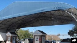 FILE- The entrance to the Naval Air Base Station in Pensacola, Fla. 