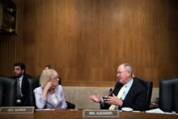 Senate Committee on Health, Education Labor and Pensions ranking member Patty Murray of Wash., and Chairman Lamar Alexander of Tenn., talk after the nomination hearing for Eugene Scalia as Secretary of Labor on Capitol Hill, Sept. 19, 2019.