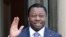FILE—Togo's President Faure Gnassingbe waves before a working lunch at the Elysee Palace in Paris on April 9, 2021.
