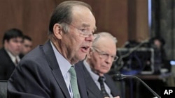 Thomas Kean (L), and Lee Hamilton, former co-chairmen of the 9/11 Commission, testify before the U.S. Senate Homeland Security and Governmental Affairs Committee hearing on the 10-year report on circumstances surrounding Sep 11, 2001 terrorist attacks, Ma