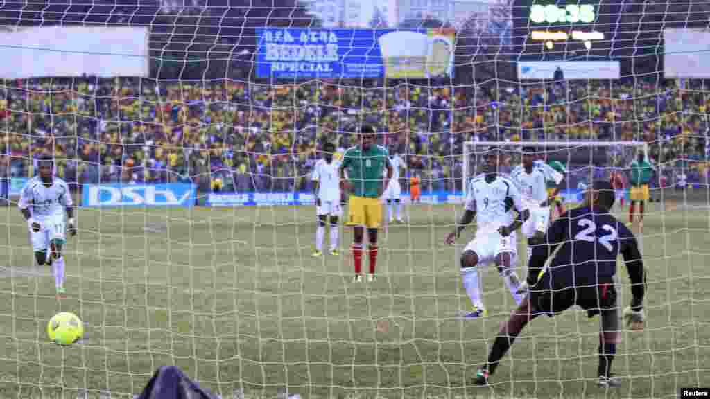 Nigeria's Emmanuel Emenike (9) scores past Ethiopia goalkeeper Jemal Tasew during their 2014 World Cup qualifying match.