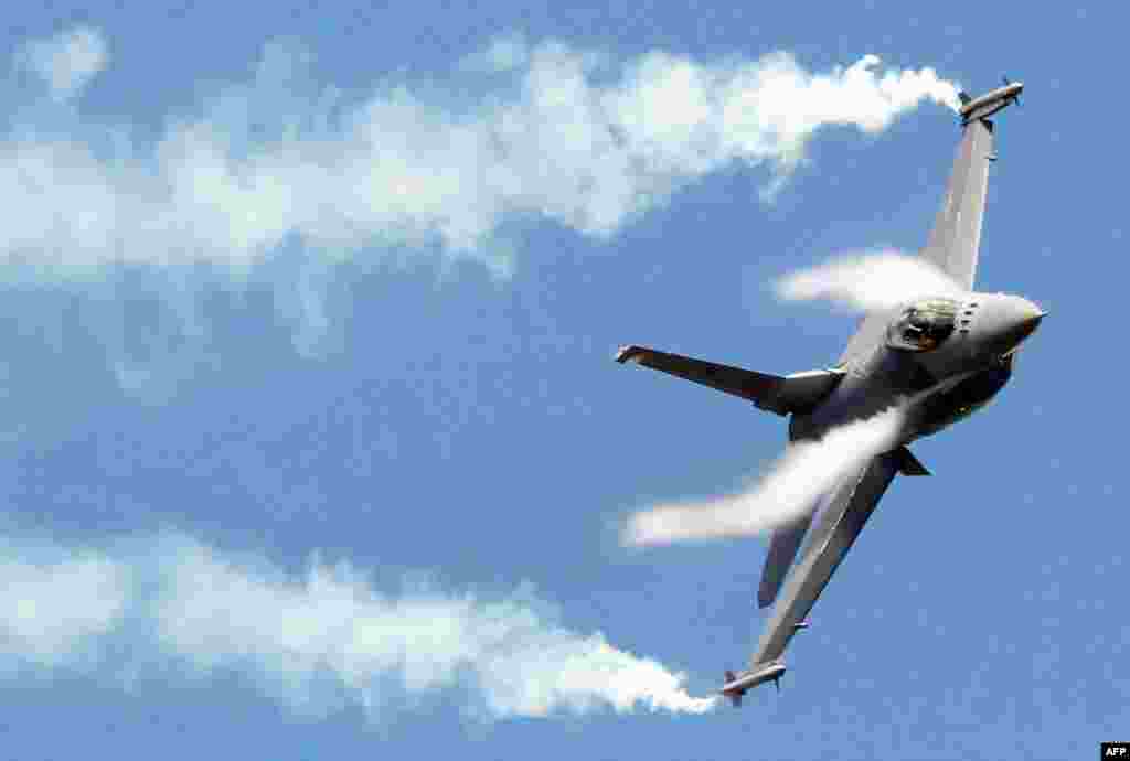 June 21: A F16 fighter jet takes part in a flying display during the 49th Paris Air Show at the Le Bourget airport near Paris.
