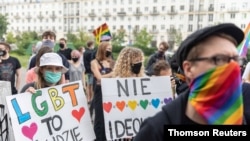 Members of a group supporting LGBT rights protest in Warsaw, Poland, June 20, 2020.
