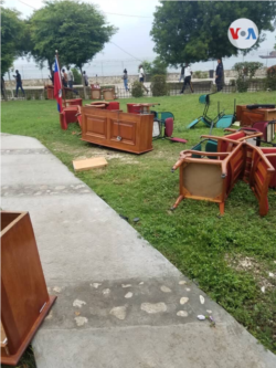 FILE - Furniture litters the ground after being dragged out of the Haitian Senate by opposition senators, May 30, 2019.