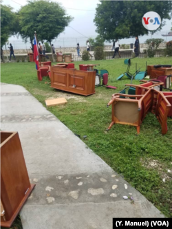 FILE - Furniture litters the ground after being dragged out of the Haitian Senate by opposition senators, May 30, 2019.