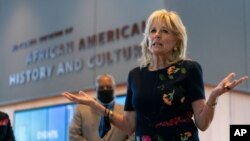 First lady Jill Biden speaks to gathered employees and media during a visit to the National Museum of African American History and Culture, May 14, 2021, in Washington. 