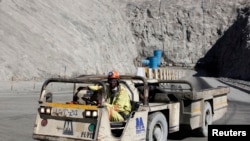 FILE - A worker drives a vehicle at Zimplats' Ngwarati Mine in Mhondoro-Ngezi May 30, 2014.