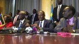 FILE - South Sudan’s First Vice President Taban Deng Gai, center, speaks to reporters in Nairobi, Kenya, Aug. 17, 2016.