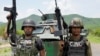 FILE PHOTO: Members of the Jalisco New Generation Cartel (CJNG), led by Nemesio Oseguera, known as “El Mencho,” undisclosed location in Michoacan state, Mexico, July 1, 2021. 