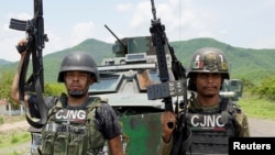FILE PHOTO: Members of the Jalisco New Generation Cartel (CJNG), led by Nemesio Oseguera, known as “El Mencho,” undisclosed location in Michoacan state, Mexico, July 1, 2021. 