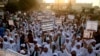 FILE - Pakistani religious students rally for the implementation of a blasphemy law and against the acquittal of Aasia Bibi, in Karachi, Pakistan, Nov. 21, 2018.