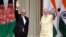 Indian Prime Minister Narendra Modi, right, and Afghan President Ashraf Ghani wave at the media before a meeting in New Delhi, India, Sept. 14, 2016. President Ghani is on a two-day visit to India.