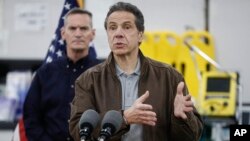 New York Gov. Andrew Cuomo speaks during a news conference alongside the National Guard at the Jacob Javits Center that will house a temporary hospital in response to the COVID-19 outbreak, March 23, 2020, in New York. 