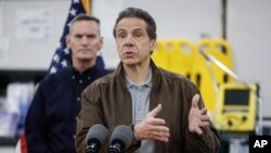 New York Gov. Andrew Cuomo speaks during a news conference alongside the National Guard at the Jacob Javits Center that will house a temporary hospital in response to the COVID-19 outbreak, March 23, 2020, in New York. 