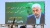 A billboard depicting Hamas' slain leader Yahya Sinwar with the Arabic slogan "if Sinwar departs from the battlefields, Palestine will birth a thousand Sinwars", during a rally in Yemen's Huthi-controlled capital Sanaa on October 18, 2024 in protest again