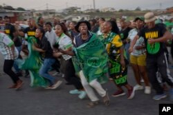 FILE — MK Party supporters celebrate in the middle of the street in Mahlbnathini village in rural KwaZulu-Natal, South Africa, on May 30, 2024.