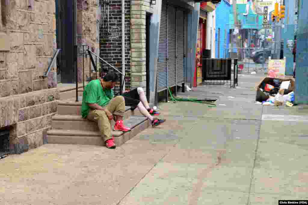 Men are passed out on the stairs of the organization, Prevention Point, a drug treatment facility in Kensington.