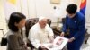 Pope Francis looks at pictures as he meets with Mongolia's Foreign Minister Batmunkh Battsetseg during his apostolic journey in Ulaanbaatar, Mongolia September 4, 2023. 