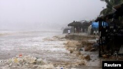 Waves flood a beach in Acapulco, Mexico, Sept. 15, 2013. 