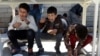 FILE - Boys eat free meals distributed by Namiq Faiq, owner of a charity project in Sulaymaniyah, in Iraqi Kurdistan, March 22, 2019.