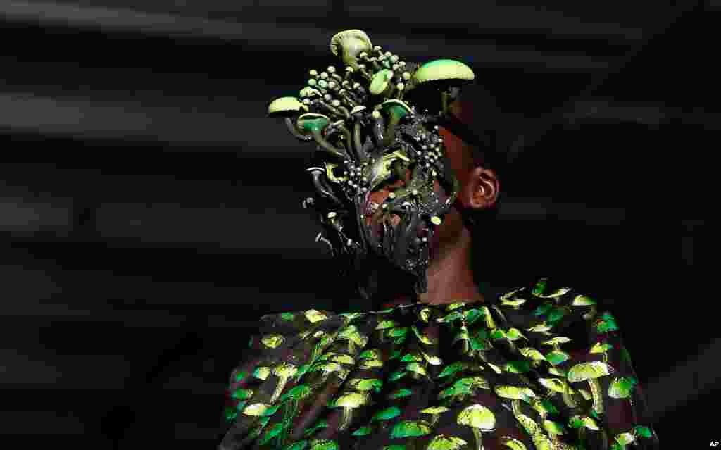 A model wears a creation as part of the Daniel Del Core women&#39;s and men&#39;s Fall Winter 2021-22 collection during Fashion Week in Milan, Italy.