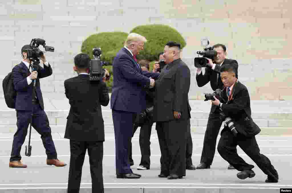 U.S. President Donald Trump meets with North Korean leader Kim Jong Un at the demilitarized zone separating the two Koreas, in Panmunjom, South Korea, June 30, 2019.